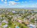 Expansive aerial view showcases the single-Gathering home, surrounded by mature trees and a tranquil neighborhood at 6103 6Th Nw Ave, Bradenton, FL 34209