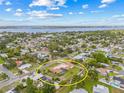 Beautiful home with a sprawling yard is captured in this aerial view, situated in a peaceful, waterfront community at 6103 6Th Nw Ave, Bradenton, FL 34209