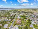 A prime location is highlighted in this aerial view of the single-Gathering home with a large, well-maintained lawn at 6103 6Th Nw Ave, Bradenton, FL 34209