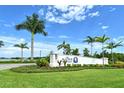 A beautiful community entrance with lush landscaping and The Alcove Riverside signage at 6204 Isla Del Ray Ave, Sarasota, FL 34240