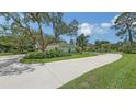 View of the house and driveway at 7604 Weeping Willow Cir, Sarasota, FL 34241
