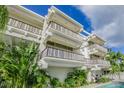 Striking architectural design of this multi-story building features private balconies on each level at 804 N Shore Dr, Anna Maria, FL 34216
