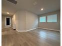 Spacious living room with abundant natural light and modern flooring at 8706 Arrow Creek Dr, Parrish, FL 34219