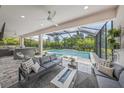 Inviting outdoor living space with a screened-in patio and a luxurious pool area at 11422 Apple Tree Cir, Bradenton, FL 34211
