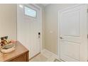 Clean, bright front door featuring modern hardware and a warm, welcoming atmosphere at 12827 Lily Quartz Loop, Parrish, FL 34219