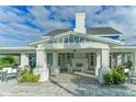 Stunning clubhouse entrance featuring rocking chairs and a welcoming fireplace at 13908 Painted Loop, Parrish, FL 34219