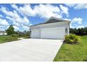 A wide driveway leads up to the two car garage of this beautiful single-story home at 13908 Painted Loop, Parrish, FL 34219