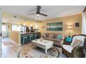 Cozy open living room connected to the kitchen, with nautical decor and comfortable seating at 1753 Dawn St # 305, Sarasota, FL 34231