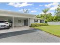 Inviting home with covered parking, well-manicured front lawn, and attractive exterior at 2115 9Th W Ave # 3D, Bradenton, FL 34205