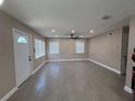 Spacious living room boasts recessed lighting, ceiling fan, and tiled floors at 2629 14Th S Ave, St Petersburg, FL 33712