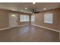 The living room has a ceiling fan, recessed lighting and natural light from the windows at 2629 14Th S Ave, St Petersburg, FL 33712