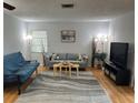 Inviting living room with neutral paint, sleek furniture, and stylish accents at 3262 Brunswick Ln # 707, Sarasota, FL 34239