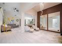 Modern living room showcasing elegant decor, stylish furniture, wood accent wall and lots of light at 3524 Brownwood Ter, North Port, FL 34286