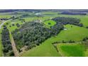 Aerial view of the rolling green land surrounding the home at 39700 State Road 70 E, Myakka City, FL 34251