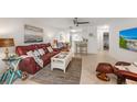 Open-concept living area with comfortable seating, tile flooring, and modern decor creates a welcoming atmosphere at 4153 66Th Street W Cir # 4153, Bradenton, FL 34209