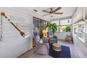 Inviting sunroom with tile flooring, bright windows, and comfortable seating, perfect for enjoying the view at 4153 66Th Street W Cir # 4153, Bradenton, FL 34209