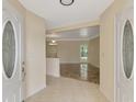 Bright foyer featuring stylish tile flooring, a view into the living area and an open floorplan at 5124 Palm Aire Dr, Sarasota, FL 34243