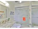 Bright bathroom features a glass-enclosed shower, granite countertop, and stylish decor at 548 Lakeside Dr # 0, Bradenton, FL 34210