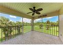 Enjoy great views from this screened patio, which has a ceiling fan and patterned flooring at 803 Montrose Dr # 201, Venice, FL 34293