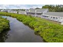 Waterfront view with lush foliage from the back patios of these beautiful villas at 805 Waterside Ln, Bradenton, FL 34209