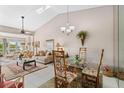 Bright and airy living room with vaulted ceilings, tile floors, and outdoor views at 805 Waterside Ln, Bradenton, FL 34209