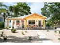 Inviting home with a charming front porch and desert-style landscaping at 2189 Hillview St, Sarasota, FL 34239