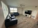 The spacious living room features neutral walls, light colored floors and bright natural light at 22214 Felton Ave, Port Charlotte, FL 33952