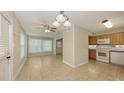 Eat-in kitchen with tile floors and stainless steel appliances, perfect for casual dining and meal preparation at 2462 Hyde Park St, Sarasota, FL 34239