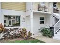 Close up of unit A103 with a well manicured yard and an inviting entrance at 999 Inlet Cir # 103, Venice, FL 34285