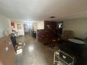 Spacious living room with brick fireplace feature and ample natural light at 11234 Areca Dr, Port Richey, FL 34668