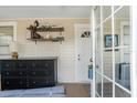 Welcoming entryway with neutral walls, black dresser, and a view of the front door, creating a clean and functional space at 1911 26Th W St, Bradenton, FL 34205