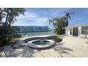 Backyard features a pool and waterfront views at 205 55Th Ave, St Pete Beach, FL 33706