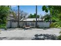 Charming home with a circular drive and privacy fencing at 259 S Polk Dr, Sarasota, FL 34236