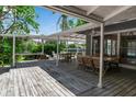 Spacious covered patio perfect for outdoor dining and entertaining with waterfront views at 259 S Polk Dr, Sarasota, FL 34236
