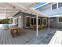 Expansive patio featuring covered area, outdoor furniture, and access to the pool at 259 S Polk Dr, Sarasota, FL 34236
