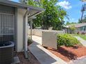 Exterior view of the property with a well-maintained walkway and partial fence at 2606 29Th Ave W # 12, Bradenton, FL 34205