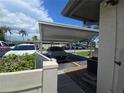 Carport parking area with multiple vehicles, providing covered parking at 2606 29Th Ave W # 12, Bradenton, FL 34205