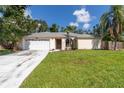 Inviting one-story home with a spacious driveway and well-maintained front yard, perfect for families at 4805 Cypress Lake Ct, Sarasota, FL 34243