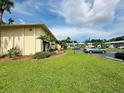 Well-manicured lawn and landscaping compliment the exterior of this Summer Lakes condominium building at 4805 Rilma Ave # 106, Sarasota, FL 34234
