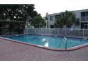 Enjoy a refreshing swim in the community pool surrounded by a well-maintained patio and lush landscaping at 5310 26Th W St # 1002, Bradenton, FL 34207