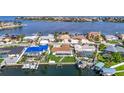 Aerial view of waterfront homes with boat docks and lush landscaping at 6341 Cocoa Ln, Apollo Beach, FL 33572