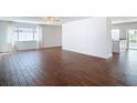 Spacious living room with wood-look floors and ample natural light at 6341 Cocoa Ln, Apollo Beach, FL 33572