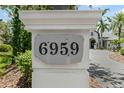 Close-up of the address marker, displaying the house number on a stone plaque at 6959 Westchester Cir, Bradenton, FL 34202