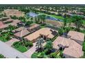 Beautiful home in an upscale golf community, featuring mature landscaping and a lake view at 7037 Brier Creek Ct, Lakewood Ranch, FL 34202