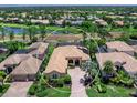 Beautiful home in an upscale golf community, featuring mature landscaping and a lake view at 7037 Brier Creek Ct, Lakewood Ranch, FL 34202