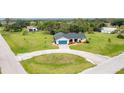 Expansive aerial view of the property showcasing its lush lawn and idyllic neighborhood setting at 1071 Owl Dr, Englewood, FL 34223