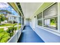 View of the long screened-in porch, offering a comfortable outdoor space at 116 Myakka Dr, Venice, FL 34293