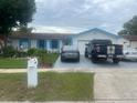 Well-maintained home featuring a tidy front yard, manicured lawn, and a charming fountain feature at 1209 Croydonwood Cir, Brandon, FL 33510