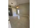 Spacious bedroom with neutral walls, tile floors, and a ceiling fan at 185 Wood Dove Ave, Tarpon Springs, FL 34689