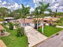 An elevated view of a cozy home and a wide driveway at 227 Monet Dr, Nokomis, FL 34275